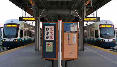 two seattle sound transit trains at stop